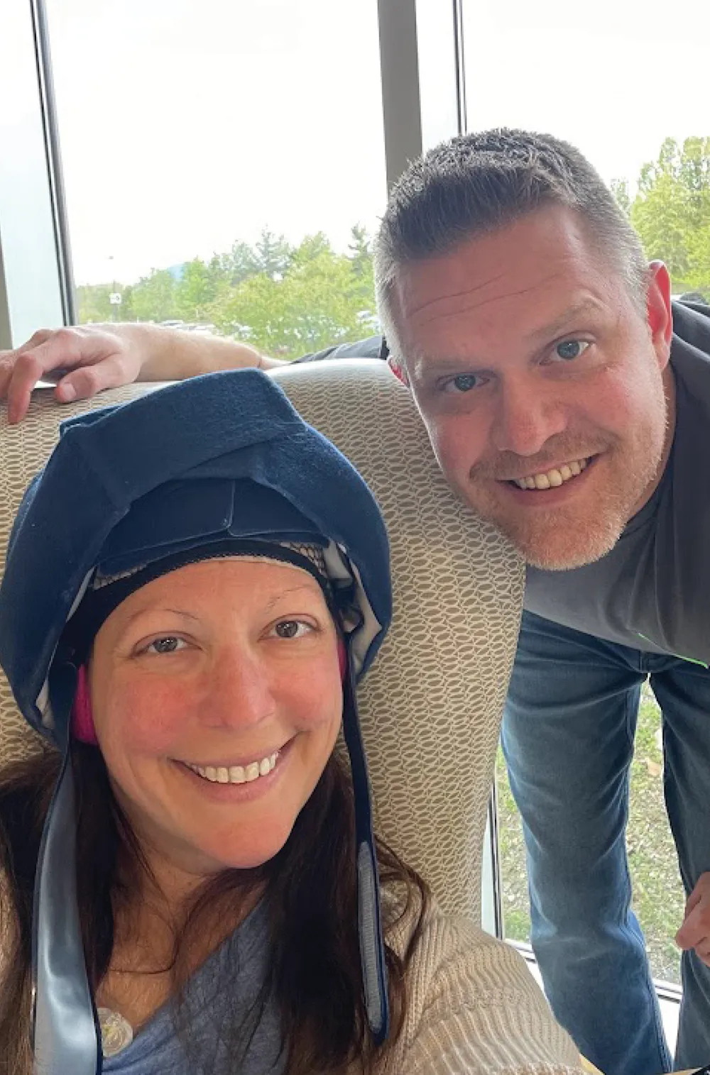 McClain undergoing cold capping with her husband Matthew next to her