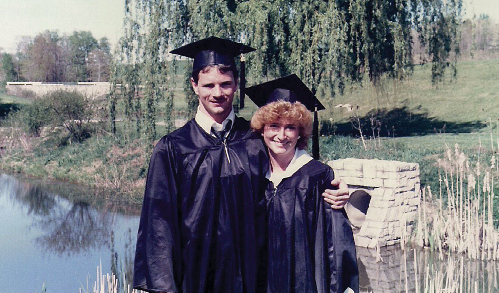 Joe and Pam Finney in their graduation cap and gown