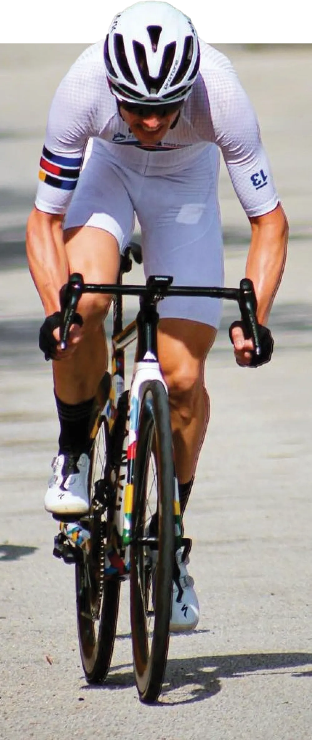 Eric McBride wearing white gear and riding his bike