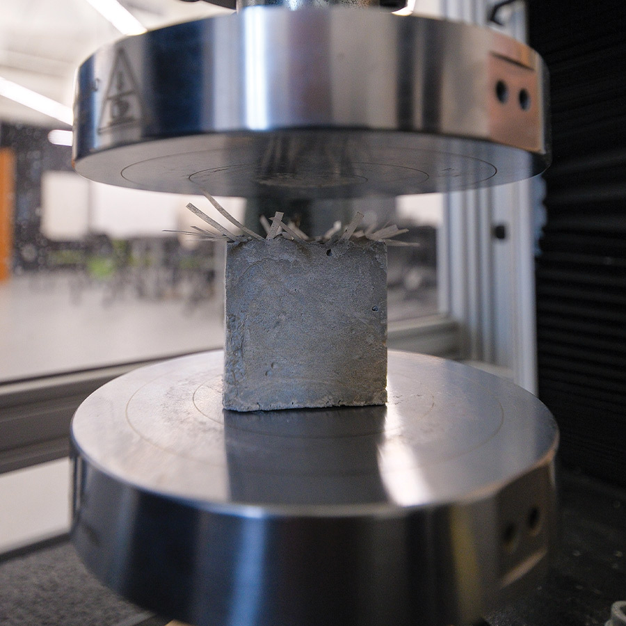 a cement-based composite block on the Instron Universal Testing Machine testing platform