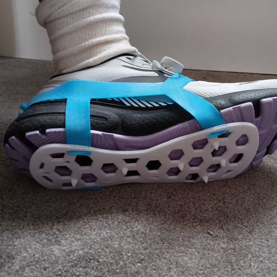 quarter view of a shoe wearing Jennifer Cichra's 3D printed spike plate