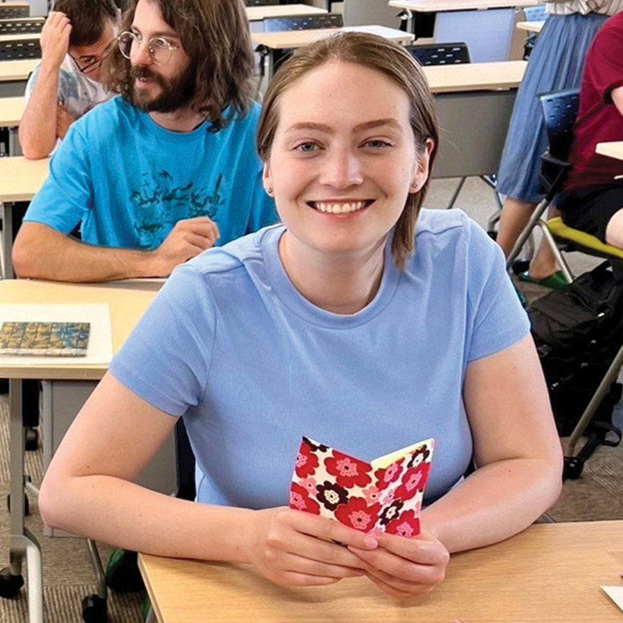 Aria Kriebel in an origami class