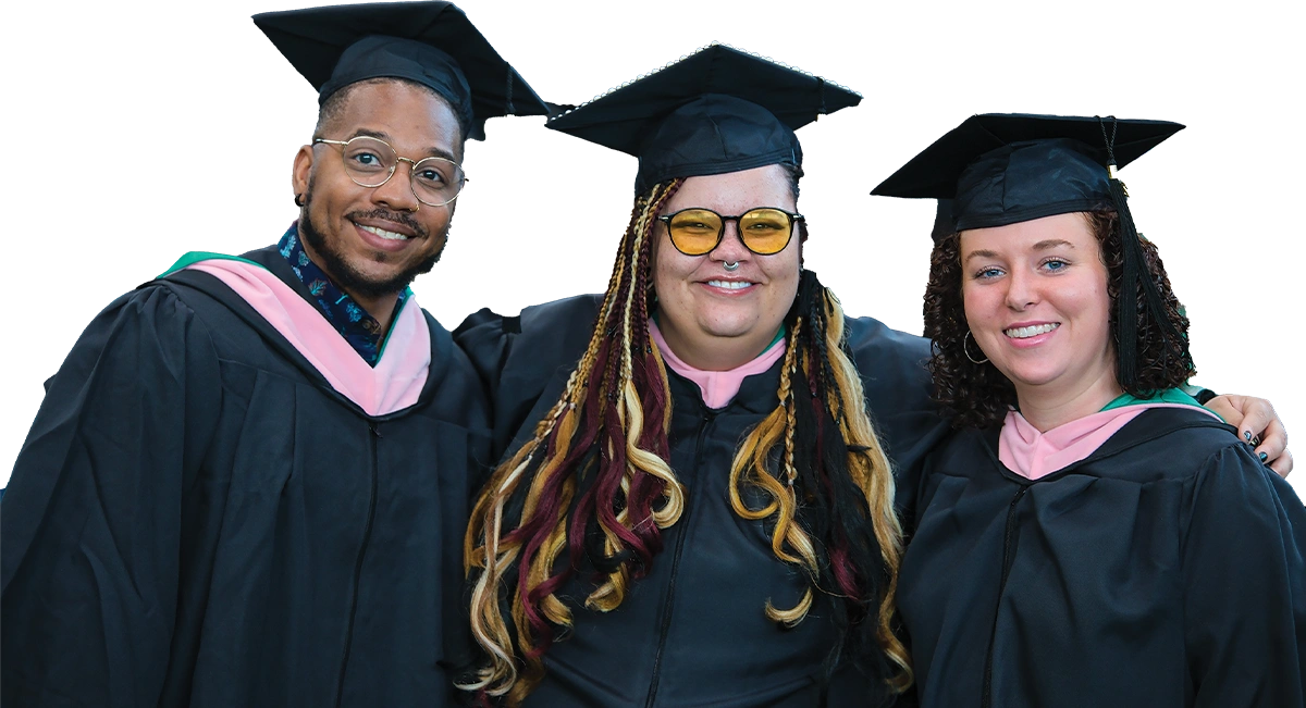 Group of three young professionals wearing graduation academic regalia, featuring black gowns and pink hoods, posing for a portrait.