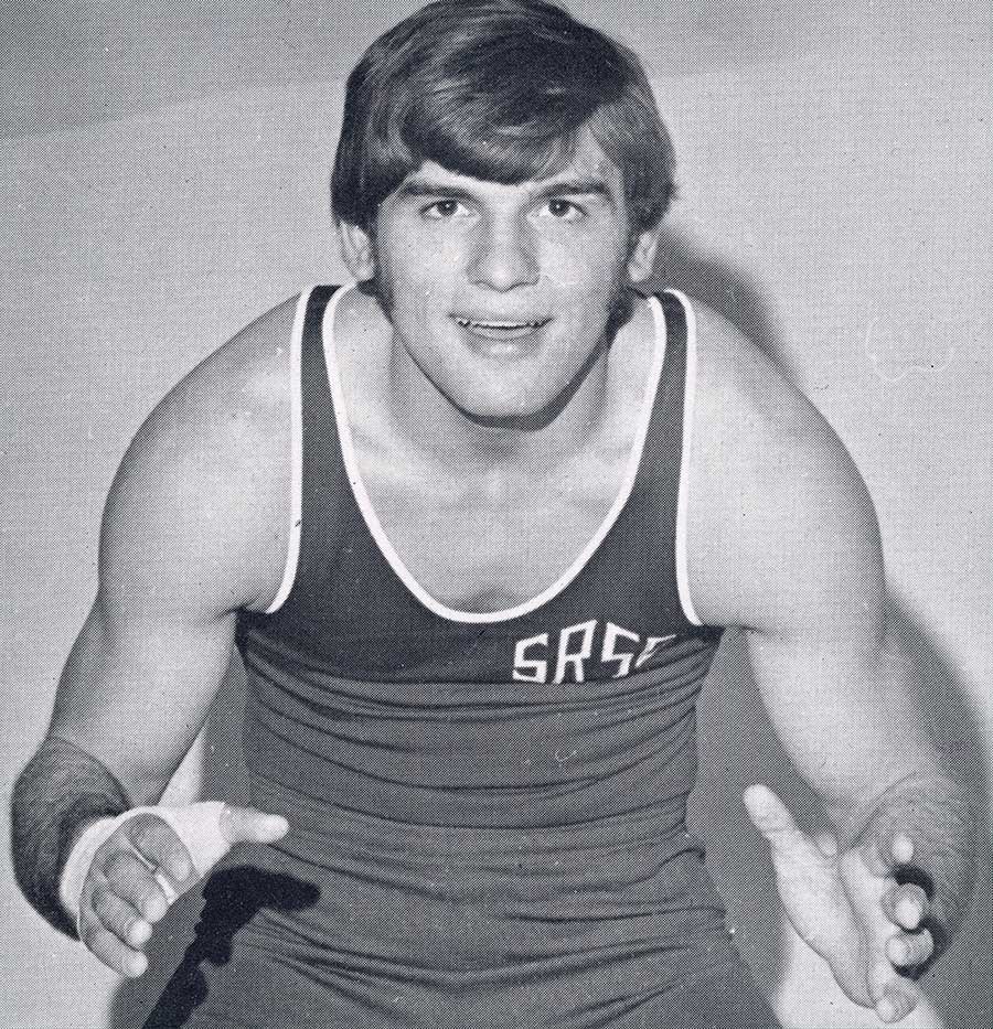 Vintage black and white portrait of a Slippery Rock wrestler in a singlet.
